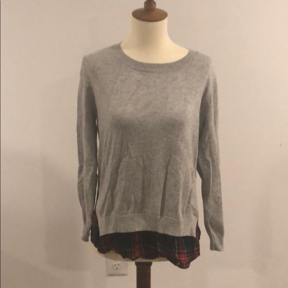 Grey sweater with plaid underlay